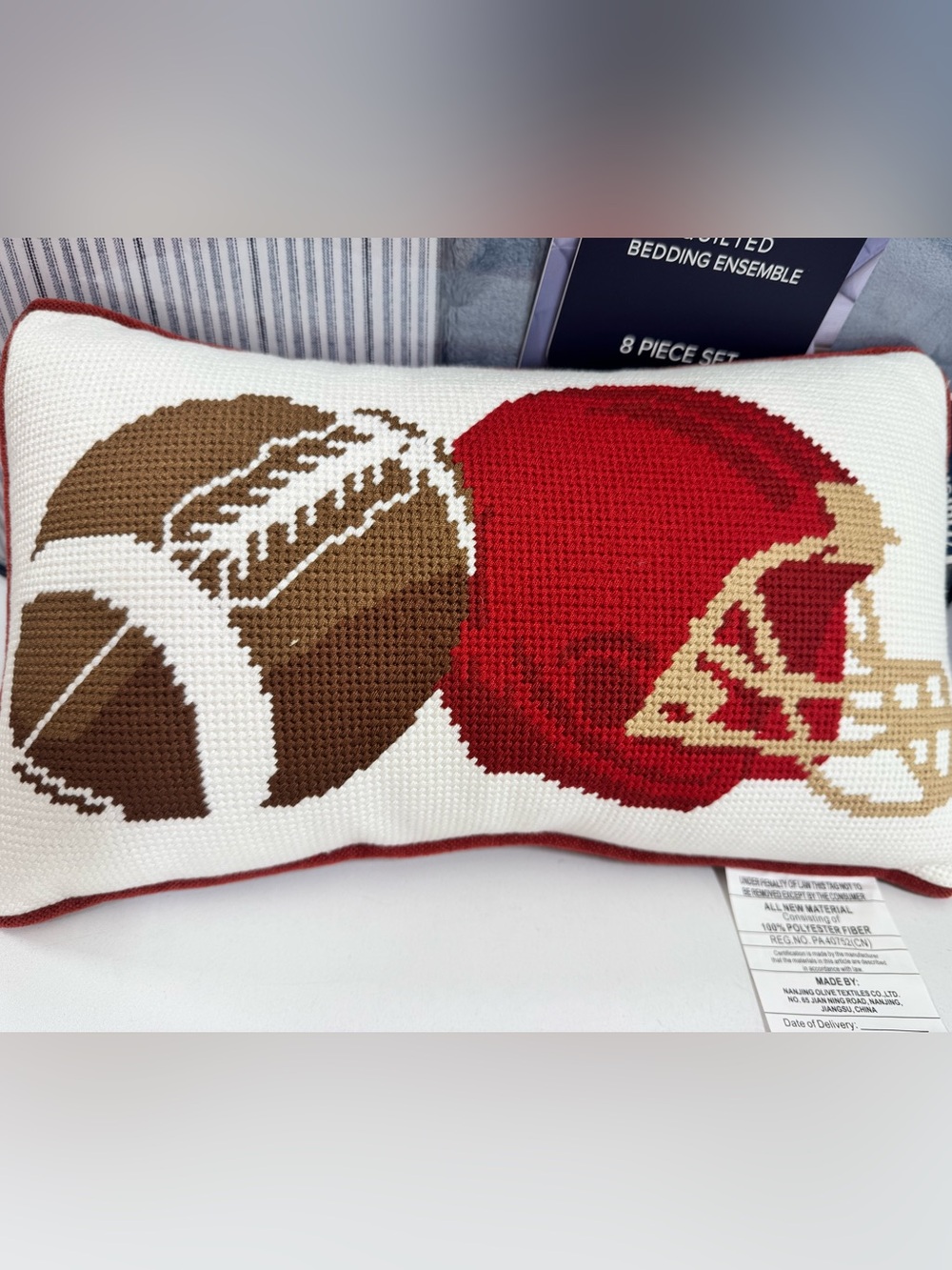 Decorative Cross-Stitch Pillow with Red and Brown Football Motif